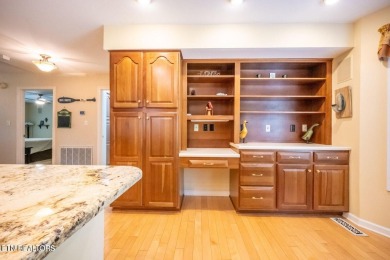 This lovely lakefront home located in a quiet cove, is nestled on Toqua Golf Course - Loudon County in Tennessee - for sale on GolfHomes.com, golf home, golf lot