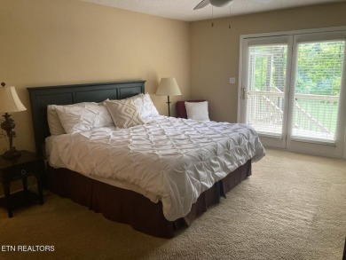 This lovely lakefront home located in a quiet cove, is nestled on Toqua Golf Course - Loudon County in Tennessee - for sale on GolfHomes.com, golf home, golf lot