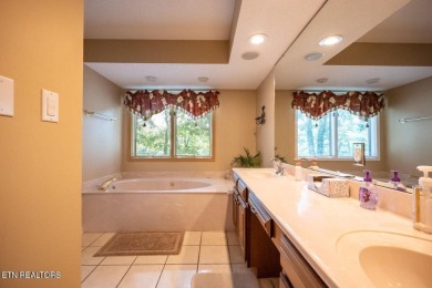 This lovely lakefront home located in a quiet cove, is nestled on Toqua Golf Course - Loudon County in Tennessee - for sale on GolfHomes.com, golf home, golf lot