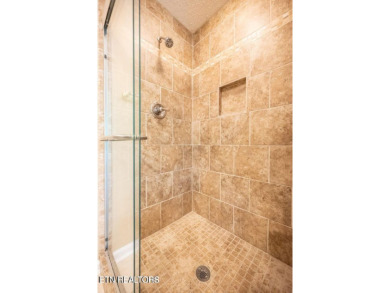 This lovely lakefront home located in a quiet cove, is nestled on Toqua Golf Course - Loudon County in Tennessee - for sale on GolfHomes.com, golf home, golf lot