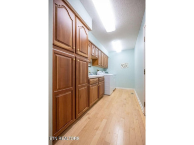 This lovely lakefront home located in a quiet cove, is nestled on Toqua Golf Course - Loudon County in Tennessee - for sale on GolfHomes.com, golf home, golf lot
