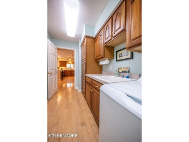 This lovely lakefront home located in a quiet cove, is nestled on Toqua Golf Course - Loudon County in Tennessee - for sale on GolfHomes.com, golf home, golf lot