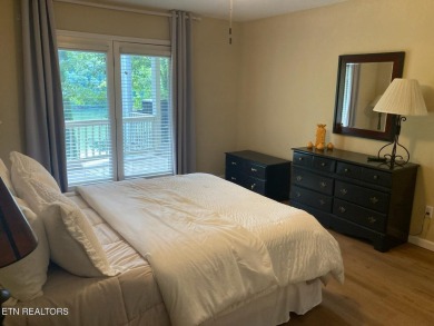 This lovely lakefront home located in a quiet cove, is nestled on Toqua Golf Course - Loudon County in Tennessee - for sale on GolfHomes.com, golf home, golf lot
