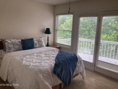 This lovely lakefront home located in a quiet cove, is nestled on Toqua Golf Course - Loudon County in Tennessee - for sale on GolfHomes.com, golf home, golf lot