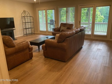 This lovely lakefront home located in a quiet cove, is nestled on Toqua Golf Course - Loudon County in Tennessee - for sale on GolfHomes.com, golf home, golf lot