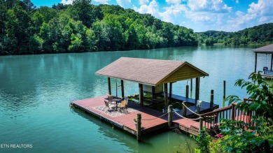 This lovely lakefront home located in a quiet cove, is nestled on Toqua Golf Course - Loudon County in Tennessee - for sale on GolfHomes.com, golf home, golf lot