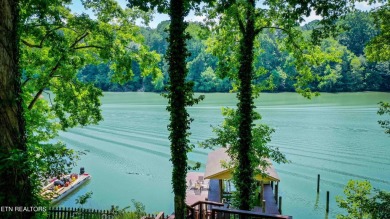 This lovely lakefront home located in a quiet cove, is nestled on Toqua Golf Course - Loudon County in Tennessee - for sale on GolfHomes.com, golf home, golf lot