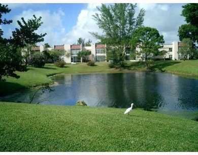 HIGHLY DESIRABLE 1ST FLOOR w/SERENE LAKE VIEWS* 2/2 HOME IN AN on Delray Beach Golf Club in Florida - for sale on GolfHomes.com, golf home, golf lot