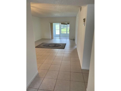 HIGHLY DESIRABLE 1ST FLOOR w/SERENE LAKE VIEWS* 2/2 HOME IN AN on Delray Beach Golf Club in Florida - for sale on GolfHomes.com, golf home, golf lot