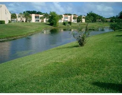 HIGHLY DESIRABLE 1ST FLOOR w/SERENE LAKE VIEWS* 2/2 HOME IN AN on Delray Beach Golf Club in Florida - for sale on GolfHomes.com, golf home, golf lot