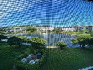 GATED COMMUNITY! ONE BED ONE BATH CONDO WITH LAKE VIEW FROM BACK on Wynmoor Golf Course in Florida - for sale on GolfHomes.com, golf home, golf lot