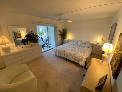 GATED COMMUNITY! ONE BED ONE BATH CONDO WITH LAKE VIEW FROM BACK on Wynmoor Golf Course in Florida - for sale on GolfHomes.com, golf home, golf lot