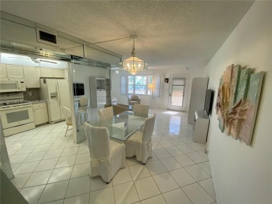 GATED COMMUNITY! ONE BED ONE BATH CONDO WITH LAKE VIEW FROM BACK on Wynmoor Golf Course in Florida - for sale on GolfHomes.com, golf home, golf lot