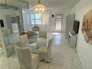 GATED COMMUNITY! ONE BED ONE BATH CONDO WITH LAKE VIEW FROM BACK on Wynmoor Golf Course in Florida - for sale on GolfHomes.com, golf home, golf lot