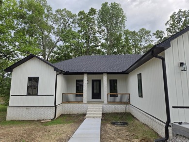 This property sounds absolutely fantastic! With its prime on Diamondhead Golf and Country Club in Arkansas - for sale on GolfHomes.com, golf home, golf lot