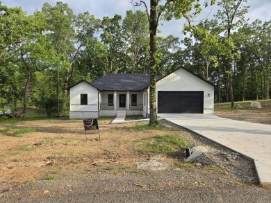 This property sounds absolutely fantastic! With its prime on Diamondhead Golf and Country Club in Arkansas - for sale on GolfHomes.com, golf home, golf lot
