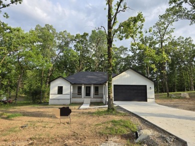 This property sounds absolutely fantastic! With its prime on Diamondhead Golf and Country Club in Arkansas - for sale on GolfHomes.com, golf home, golf lot