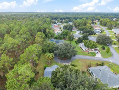 Welcome home to your little sanctuary tucked along the edge of a on Royal Oaks Golf Club in Florida - for sale on GolfHomes.com, golf home, golf lot