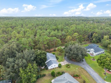 Welcome home to your little sanctuary tucked along the edge of a on Royal Oaks Golf Club in Florida - for sale on GolfHomes.com, golf home, golf lot