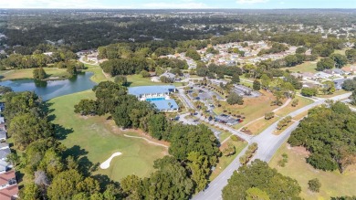 Welcome home to your little sanctuary tucked along the edge of a on Royal Oaks Golf Club in Florida - for sale on GolfHomes.com, golf home, golf lot