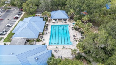 Welcome home to your little sanctuary tucked along the edge of a on Royal Oaks Golf Club in Florida - for sale on GolfHomes.com, golf home, golf lot