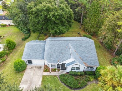 Welcome home to your little sanctuary tucked along the edge of a on Royal Oaks Golf Club in Florida - for sale on GolfHomes.com, golf home, golf lot