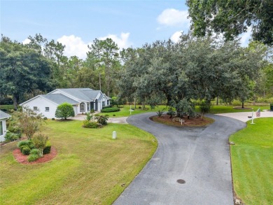 Welcome home to your little sanctuary tucked along the edge of a on Royal Oaks Golf Club in Florida - for sale on GolfHomes.com, golf home, golf lot