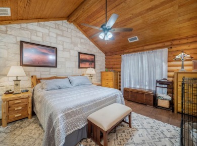 This stunning log cabin features 3 bedrooms, 2 bathrooms, and on Lago Vista Golf Club in Texas - for sale on GolfHomes.com, golf home, golf lot