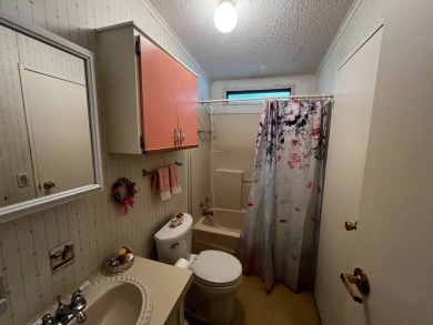 Welcome to this well-maintained 2-bedroom, 2-bath home offering on Lake Henry Golf Club in Florida - for sale on GolfHomes.com, golf home, golf lot
