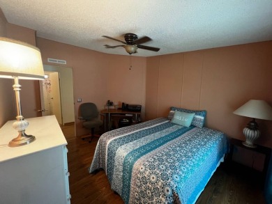 Welcome to this well-maintained 2-bedroom, 2-bath home offering on Lake Henry Golf Club in Florida - for sale on GolfHomes.com, golf home, golf lot