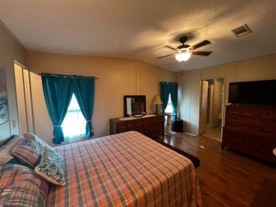 Welcome to this well-maintained 2-bedroom, 2-bath home offering on Lake Henry Golf Club in Florida - for sale on GolfHomes.com, golf home, golf lot