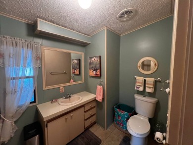 Welcome to this well-maintained 2-bedroom, 2-bath home offering on Lake Henry Golf Club in Florida - for sale on GolfHomes.com, golf home, golf lot