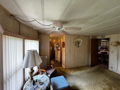 Charming 1982 Palm double-wide manufactured home located in the on Rolling Greens Executive Golf Community in Florida - for sale on GolfHomes.com, golf home, golf lot