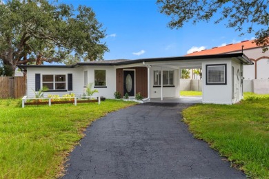 Prime location in the heart of Dunedin! 3-bedroom, 2-bath home on The Dunedin Country Club in Florida - for sale on GolfHomes.com, golf home, golf lot