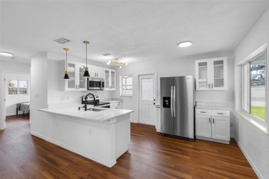 Prime location in the heart of Dunedin! 3-bedroom, 2-bath home on The Dunedin Country Club in Florida - for sale on GolfHomes.com, golf home, golf lot