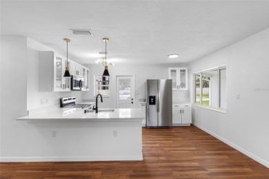 Prime location in the heart of Dunedin! 3-bedroom, 2-bath home on The Dunedin Country Club in Florida - for sale on GolfHomes.com, golf home, golf lot