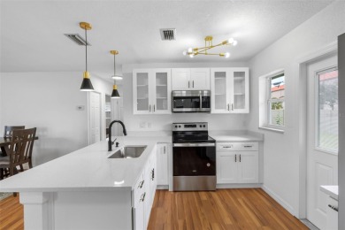 Prime location in the heart of Dunedin! 3-bedroom, 2-bath home on The Dunedin Country Club in Florida - for sale on GolfHomes.com, golf home, golf lot