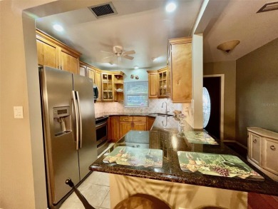 Golf Course Views, Lake Tarpon Strolls, and Minutes to the on Tarpon Woods Golf Club in Florida - for sale on GolfHomes.com, golf home, golf lot