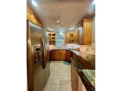 Golf Course Views, Lake Tarpon Strolls, and Minutes to the on Tarpon Woods Golf Club in Florida - for sale on GolfHomes.com, golf home, golf lot