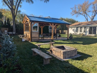 This exquisite, four-bedroom home, nestled in a serene Downers on Green Meadows Golf Club in Illinois - for sale on GolfHomes.com, golf home, golf lot