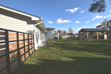 This exquisite, four-bedroom home, nestled in a serene Downers on Green Meadows Golf Club in Illinois - for sale on GolfHomes.com, golf home, golf lot