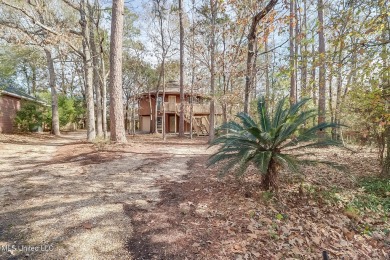 Calling all nature lovers!  Versatile two story Topsider home on Diamondhead Country Club in Mississippi - for sale on GolfHomes.com, golf home, golf lot