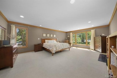 Welcome to your dream home on the shores of private all-sports on Pine Lake Country Club in Michigan - for sale on GolfHomes.com, golf home, golf lot