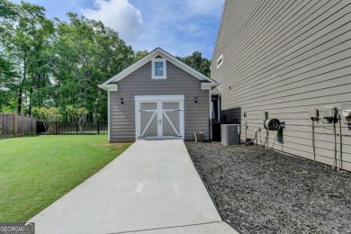 Nestled in a serene cul-de-sac, this meticulously maintained on Reunion Golf Club in Georgia - for sale on GolfHomes.com, golf home, golf lot