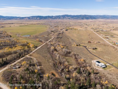 Victor Alpine Setting- this treed site slopes gently, is covered on Headwaters Club At Teton Springs in Idaho - for sale on GolfHomes.com, golf home, golf lot