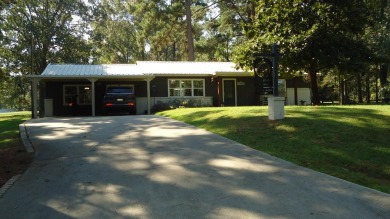 A beautiful water-view home on Toledo Bend Lake.  THIS ONE on Cypress Bend Golf Course in Texas - for sale on GolfHomes.com, golf home, golf lot