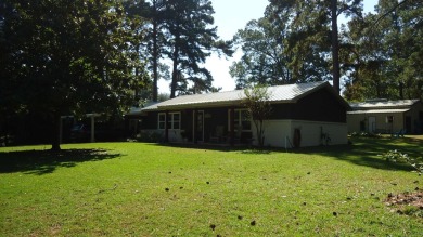 A beautiful water-view home on Toledo Bend Lake.  THIS ONE on Cypress Bend Golf Course in Texas - for sale on GolfHomes.com, golf home, golf lot