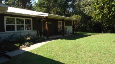 A beautiful water-view home on Toledo Bend Lake.  THIS ONE on Cypress Bend Golf Course in Texas - for sale on GolfHomes.com, golf home, golf lot