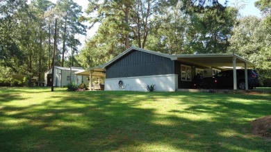 A beautiful water-view home on Toledo Bend Lake.  THIS ONE on Cypress Bend Golf Course in Texas - for sale on GolfHomes.com, golf home, golf lot