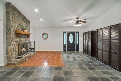 Peaceful Diamondhead Retreat with Golf Course Views  Sunroom on Diamondhead Golf and Country Club in Arkansas - for sale on GolfHomes.com, golf home, golf lot